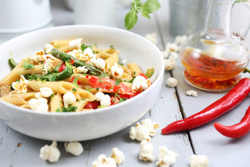 Penne  pasta with asparagus, smoked tofu, chilli peppers and mini corn onions in nut sauce
