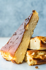 San Sebastian Cheesecake Slice on Marble Surface / Creamy Plain New York Style.