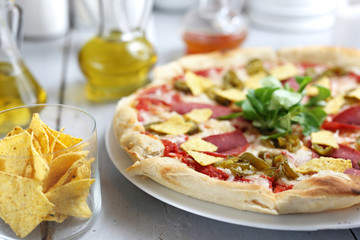 Fast food. Vegetarian pizza with crispy nachos.