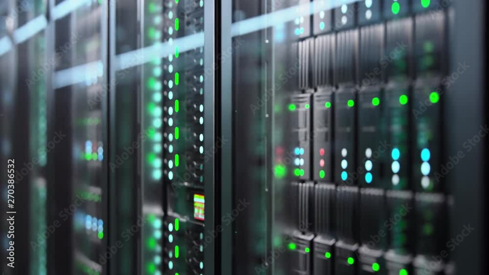Wall mural camera slowly moving in data center showing server equipment with flickering light indicators, close