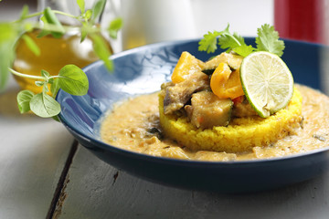 Green curry with eggplant, zucchini and celery served with yellow rice.