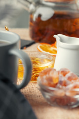 Chinese tea teapot lemon ginger honey on light tablecloth. Tea ceremony