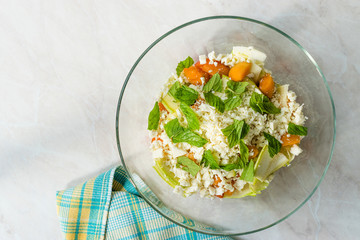 Zucchini and Apricot Salad with Cheese and Mint Leaves Ready to Mix Before Eat.