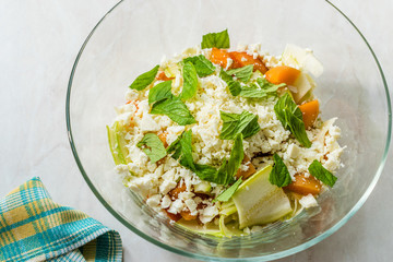 Zucchini and Apricot Salad with Cheese and Mint Leaves Ready to Mix Before Eat.