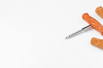 corkscrew and wine cork isolated on white background