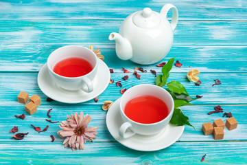 healthy herbal tea over blue background