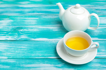healthy herbal tea over blue background