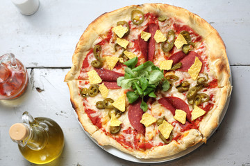 Vegetarian pizza with soy salami. A healthy meatless diet.
