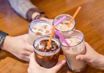 Party concept, girl with friends hold coffee cups and say cheers happy hangout together in cafe, lifestyle, copy space, top view, close up - Powered by Adobe