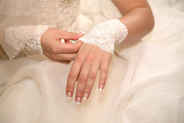 the bride is the bandage on his hand. fashion and beauty of festive attire.