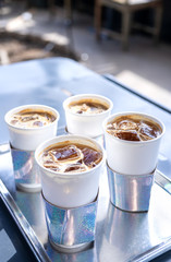 Coffee time with friends, cups of drink in coffeehouse, party concept, happy hangout together in cafe, lifestyle, copy space, top view, close up