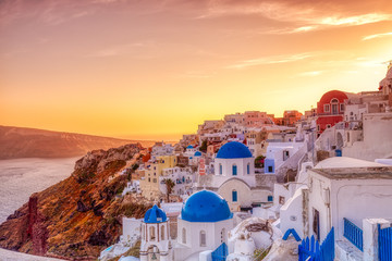 Oia village in Santorini island at sunset in Greece