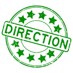 Grunge green direction with star icon round rubber seal stamp on white background