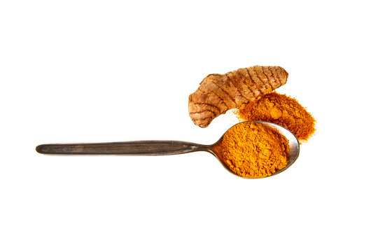 Turmeric Powder In Spoon And Fresh Turmeric Root Isolated On White Top View