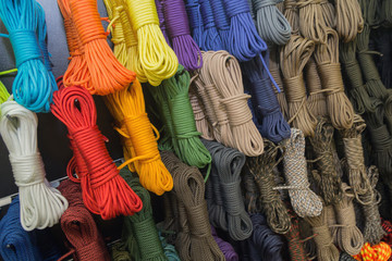 Multipurpose ropes of different colors on the shop window. Equipment