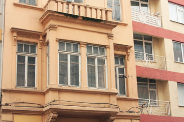 Kadık&ouml;y is a neighborhood famous for historical houses and buildings scattered around. Orange apartments with big windows. Istanbul, Turkey. 