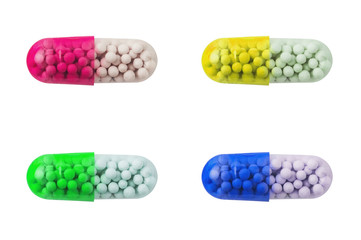 Set of four different color yellow, green, red, blue pills healthy or narcotic in form of transparent oval capsule isolated on white background