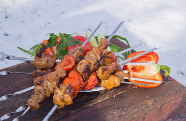 meat on skewers fried on the grill