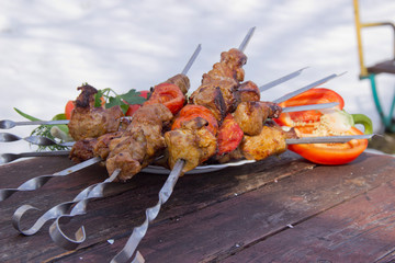 meat on skewers fried on the grill