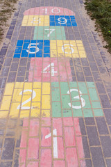 Children game hopscotch on pavement - 270393587
