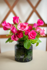 Fresh roses on chair vintage chair.