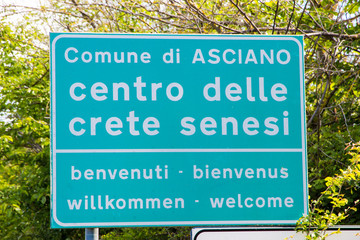 Welcoming street sign near Asciano (SI), Tuscany, Italy