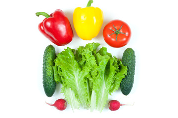 Fresh colorful organic vegetables captured from above (top view, flat lay) isolated on a white background. Layout with free (copy) space. Healthy food conception. Ingredients for salad