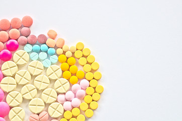 Abstract colorful drug pills on plain background of medicine is capsule ,tablet in pharmacy that are solid pharmaceutical oral dosage form of medication for treatment 
