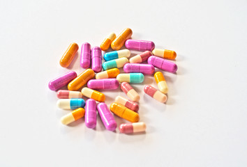 Colorful drug pills on plain background in variety types of medicine is capsules ,tablets in...