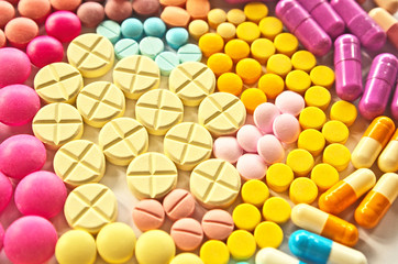Colorful drug pills texture pattern background in variety types of medicine is capsule ,tablet in...