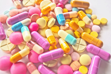 Colorful drug pills texture pattern background in variety types of medicine is capsule ,tablet in...