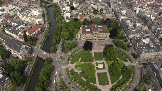 Drone flight over the Place de la Republique in Starsbourg, France. The river Rempart is seen as well as the architecture of this city in France.