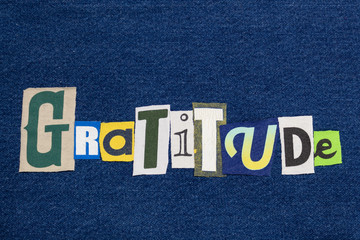 GRATITUDE text word collage, colorful fabric on blue denim, grateful concept, horizontal aspect