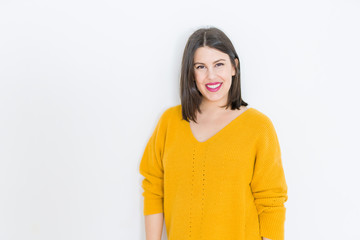 Obraz premium Beautiful brunette young woman smiling confident and cheerful over isolated white background wearing casual yellow sweater