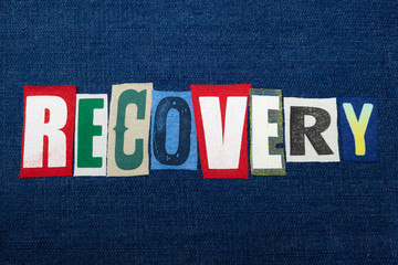 RECOVERY text word collage, colorful fabric on blue denim, rehabilitation and recovery, horizontal aspect