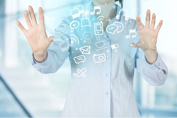 Business woman touching the screen of the mechanical gear