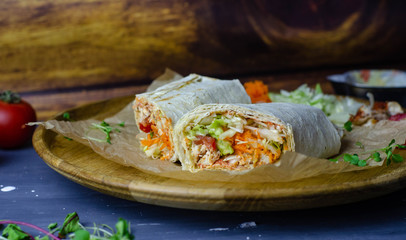 Homemade shawarma / burrito / chicken roll with vegetables and sauce. Top view ingredients