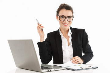 Photo of happy female worker businesswoman dressed in formal wear sitting at desk and working on...
