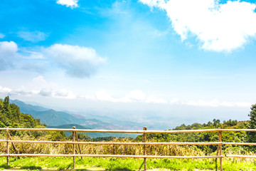 Fototapeta premium The beautiful mountain landscape has a hilltop covered with forests and cloudy skies in Thailand.