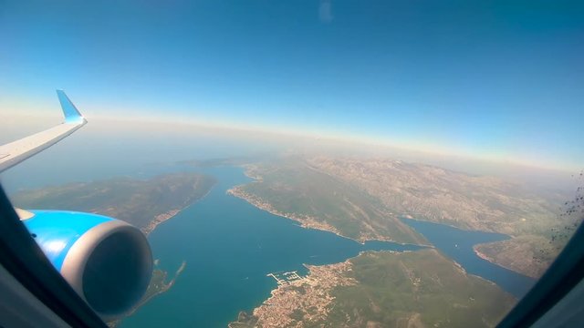 Islands and water shown from an airplane window