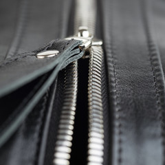 Close-up of leather products zipper opening. Leather goods.