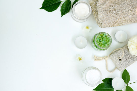 Spa aromatic sea salt, handmade natural spa products concept, view from above, space for a text on white background