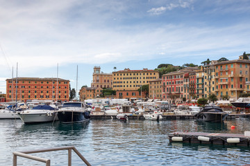 Fototapeta premium Santa Margherita. Italy. 04-29-2019. Colored houses and boats at Santa Margherita Ligure harbor in Italy