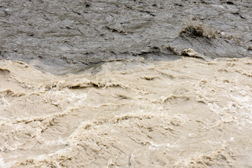 Unmixed waters of Black and White Aragvi River. Georgia
