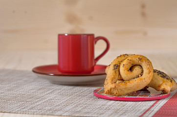 cup of coffee and cookies on wooden table