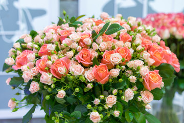 Beautiful wedding bouquet in hands of the bride. beautiful bouquet of roses