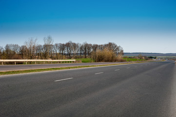 Fototapeta premium Spring asphalt road landscape