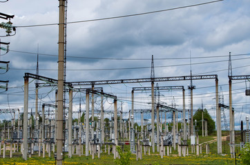 Electricity distribution station. Lots of wires, poles and shields.