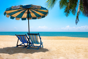View of two chairs and parasols on the beach, sky Summer vacation concept Consists of travel websites 