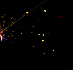 flash of light with sparks on a black background